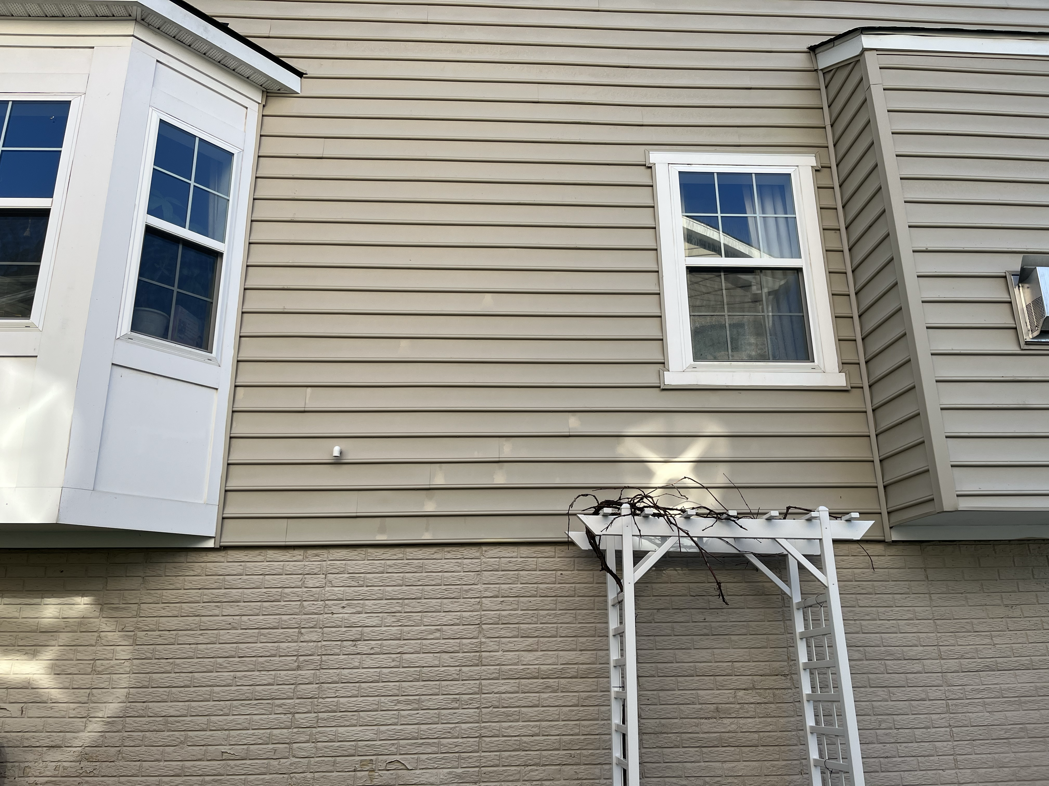 Cleaned house siding after washing